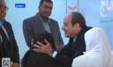 الرئيس السيسي يقبل رأس سيدة...